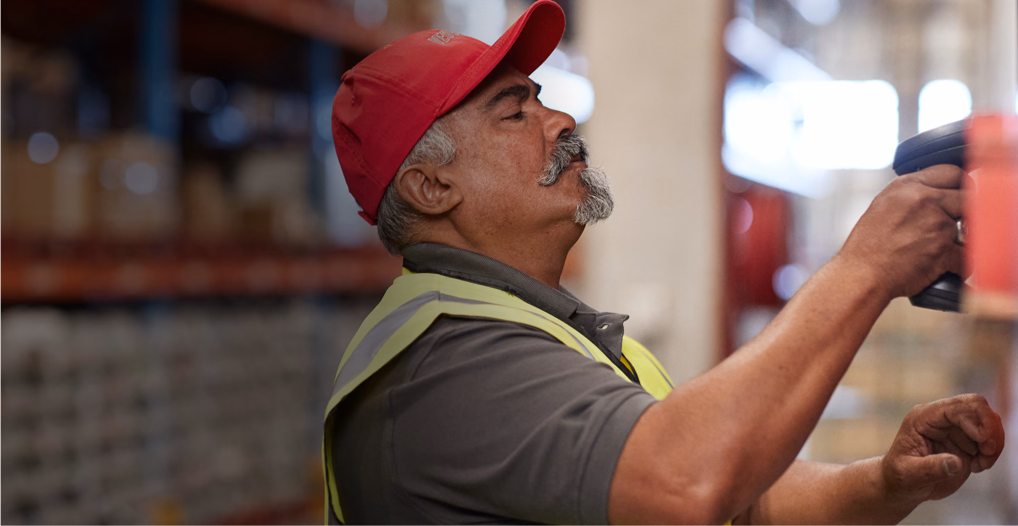 A man in his fifties working at a national hardware and lumber store. He’s fitting in easier diabetes management in his busy life with a virtual chronic care program.