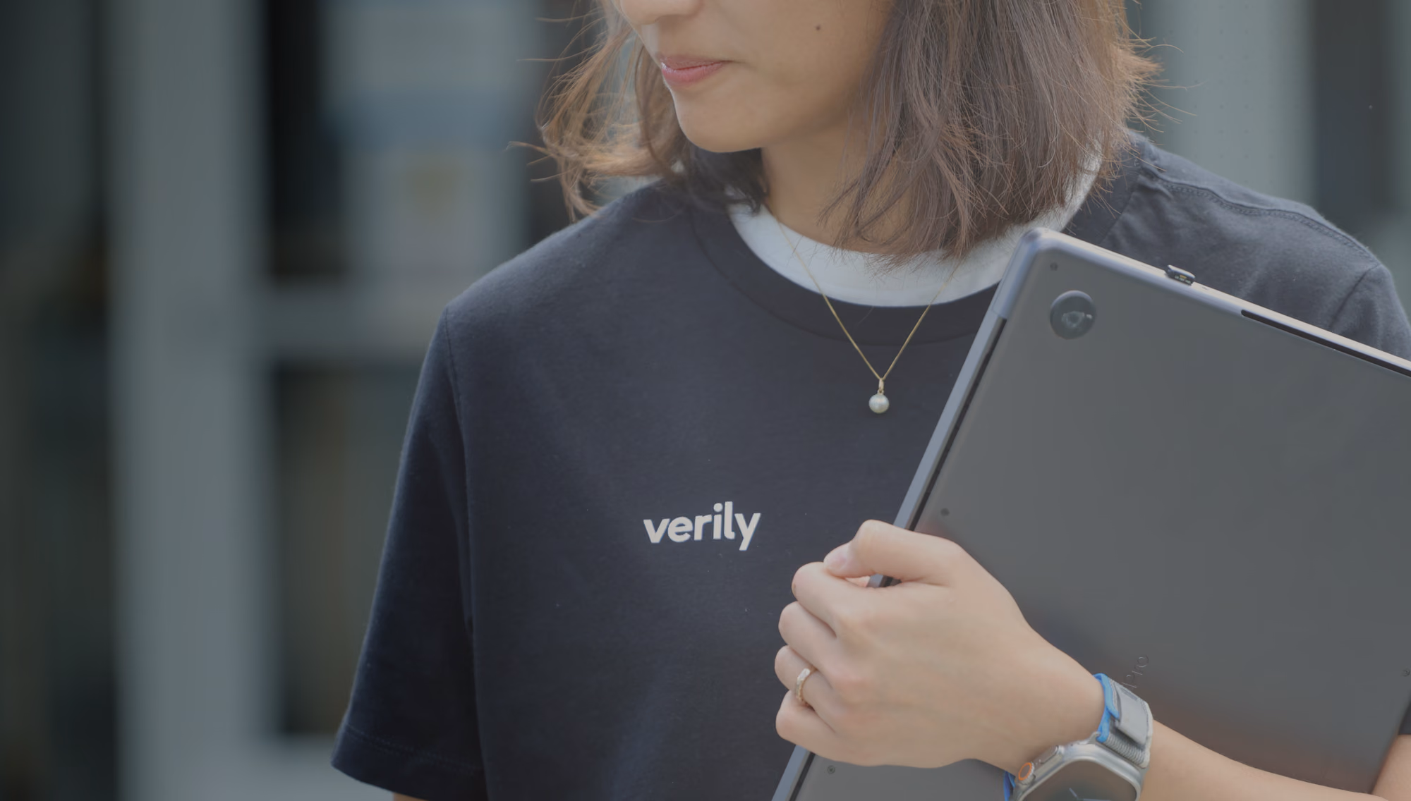 Verily team member in verily swag, walking around the campus.