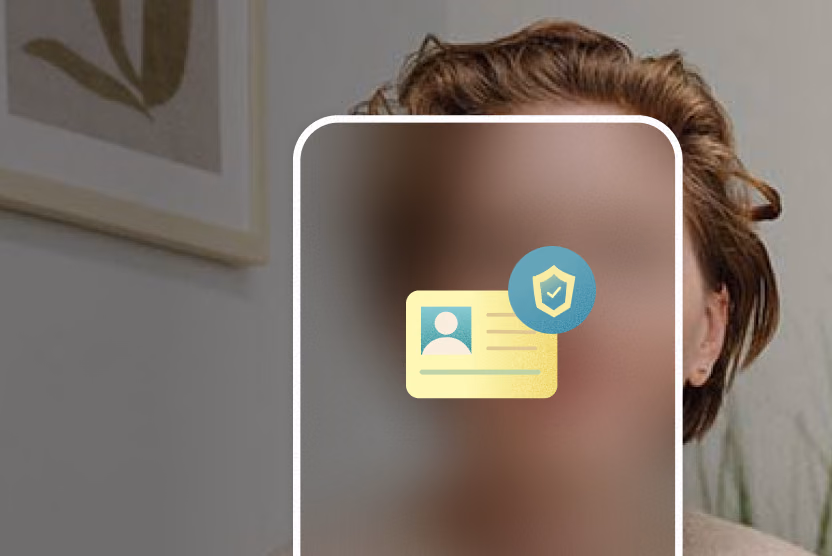 A woman looks straight ahead sitting in a waiting room. Icons representing identification and security appear inside a smartphone outline that blocks and blurs her face.